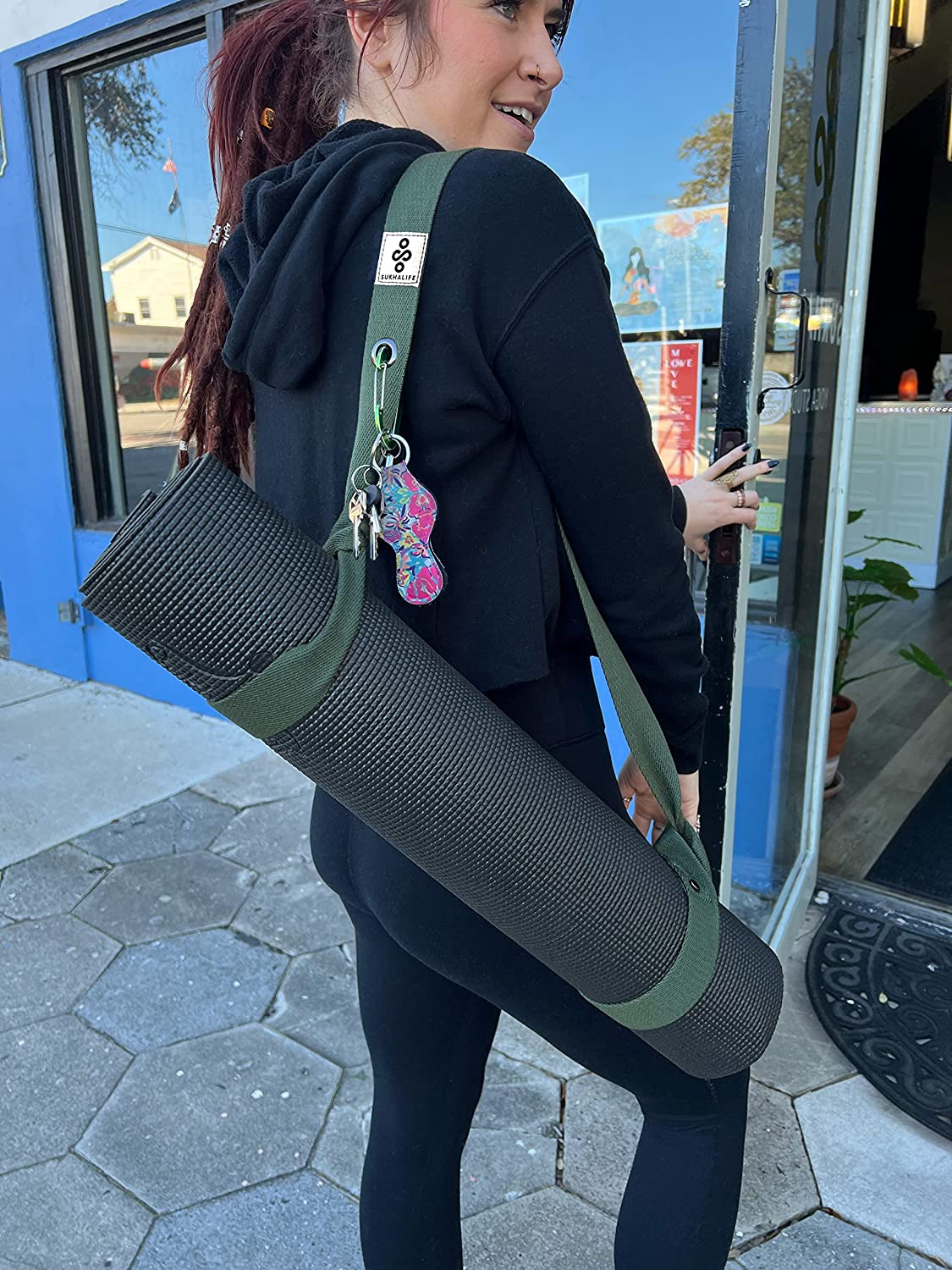 Yoga mat with carrying strap